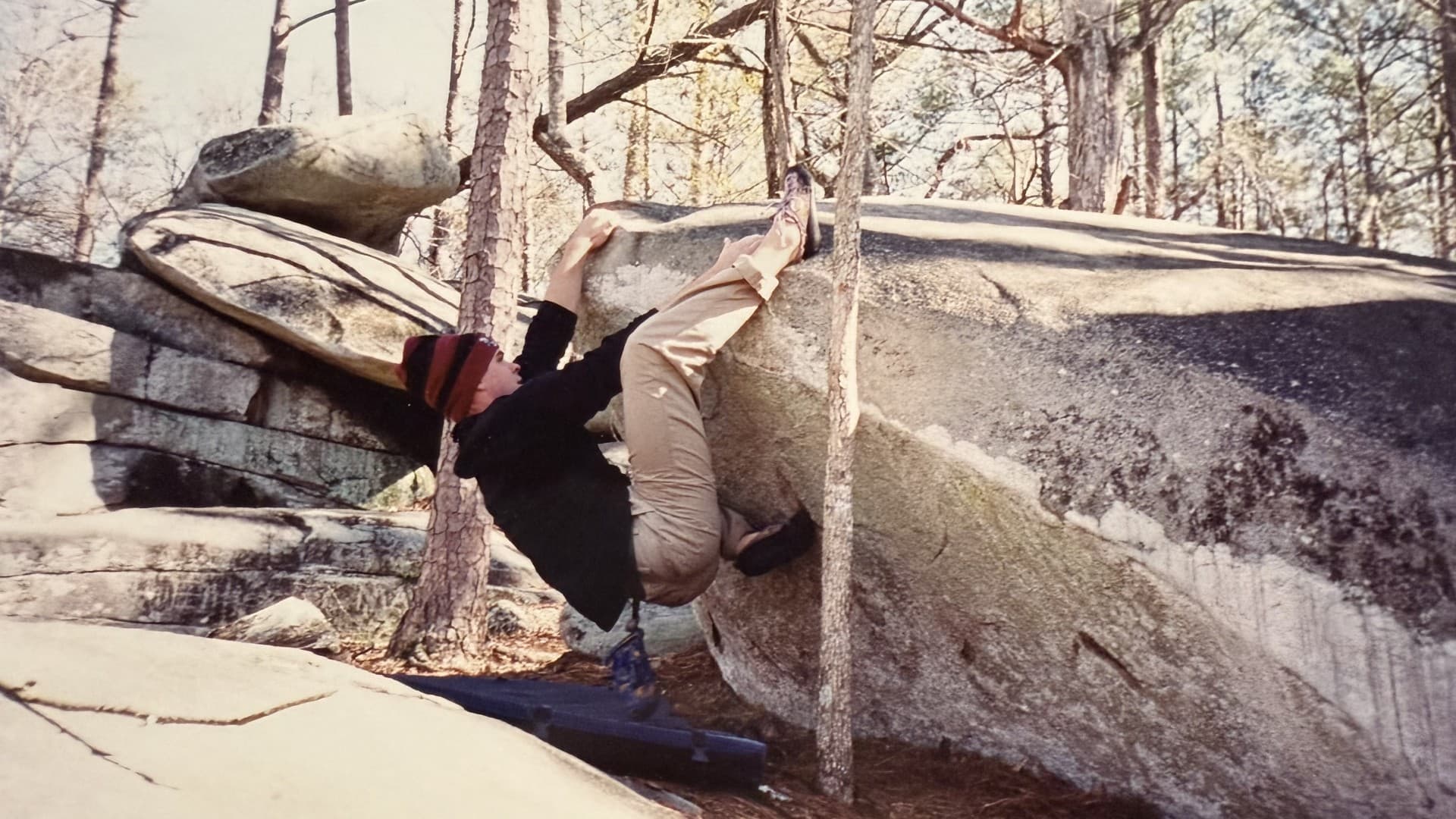 Jason Strickland bouldering on a granite outcrop at Shaking Rock Park in Georgia